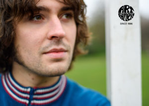 ART GALLERY CLOTHING SIXTIES MOD KNITWEAR Sailor blue, zip through funnel neck cardigan with sailor blue, red & off white striped neck, cuffs & waistband.